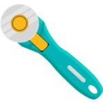 Rotary fabric cutter used for smooth and precise cuts.